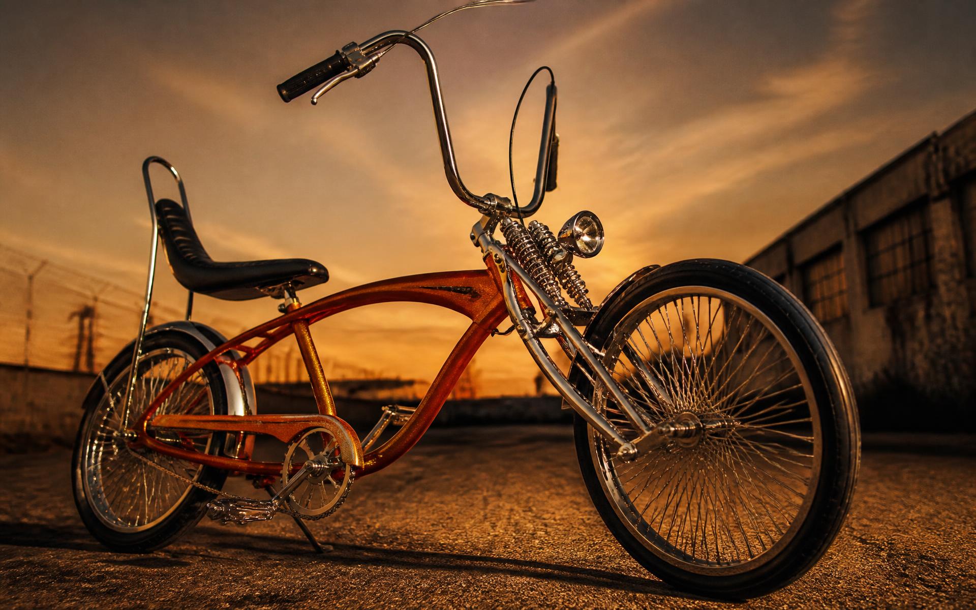 Custom metalflake chopper bicycle at dusk